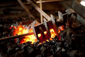 hot rake in coals- blacksmithing